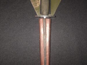 Antique sword with a detailed hilt and long blade.