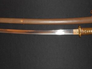 A traditional Japanese katana with a brown scabbard and ornate handle.