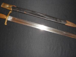A polished katana blade with its wooden scabbard.