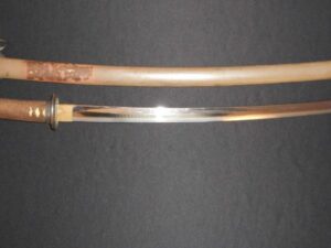 A traditional Japanese katana with its scabbard.