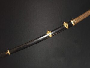 Elegant black katana with golden fittings.