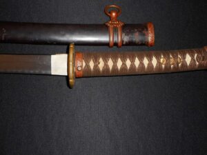 Close-up of a traditional Japanese katana handle and guard.